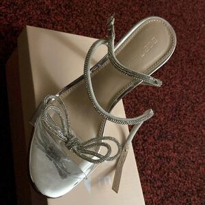 Silver BCBG brand new wrap around heels 7.5 size